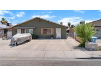Charming single-story home with large driveway, mature landscaping, and neutral color scheme at 4565 Halbert Ave, Las Vegas, NV 89110