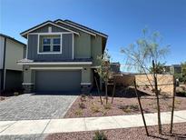 Two-story home featuring a paved driveway and a well-manicured front yard at 505 Red Lovebird Ave # Lot 1229, Henderson, NV 89011