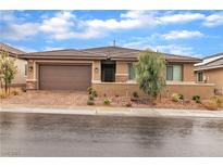Beautiful single-story home featuring a low-maintenance landscaped front yard and a two-car garage at 741 Monroe Hill Pl, Henderson, NV 89011