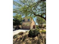 Charming two-story home with landscaped yard and two car garage, shaded by mature trees in a well maintained neighborhood at 10692 Tulip Valley Rd, Las Vegas, NV 89179
