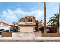 Charming two-story home with a two-car garage and desert landscaping at 2307 Tuscarora Ct, Las Vegas, NV 89142