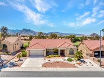 Charming single-story home featuring a red tile roof and a well-manicured desert landscape at 2829 Golf Links Dr, Las Vegas, NV 89134