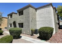 Condominium exterior featuring multi-level patios and stone-covered landscaping at 3151 Soaring Gulls Dr # 2147, Las Vegas, NV 89128