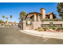 Welcoming entrance to Flamingo Heights featuring desert landscaping and a gated entry at 4083 Nook Way # D, Las Vegas, NV 89103