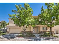 Charming two-story home with a two-car garage and mature trees at 8040 Arcadian Ln, Las Vegas, NV 89147