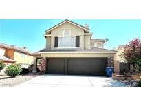 Two-story home with a three-car garage and well-maintained landscaping at 8397 San Ramon Dr, Las Vegas, NV 89147