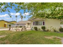 Charming single-story home with a well-maintained lawn and classic desert landscaping at 2706 Colanthe Ave, Las Vegas, NV 89102