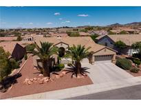 Beautiful one-story home featuring a well-kept yard, desert landscaping, and a two-car garage in a vibrant community at 2752 Fort Myer Ave, Henderson, NV 89052
