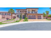 Stunning two-story home with a stone facade, three-car garage, and meticulously landscaped front yard at 2820 Sisteron Ct, Henderson, NV 89044