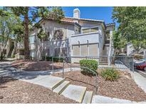 Charming two-story condo with mature trees and landscaped grounds in a residential community at 5241 Caspian Springs Dr # 203, Las Vegas, NV 89120