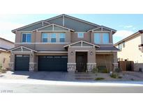 Beautiful two-story home featuring a two-car garage and welcoming front porch at 7855 Skyler Falls Ln, North Las Vegas, NV 89084