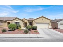 Charming single-story home with a well-maintained front yard and attached two-car garage at 1212 E Rome Blvd, North Las Vegas, NV 89086