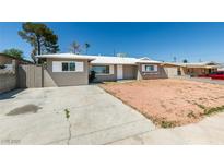 Charming single-story home with fresh exterior paint, driveway and rock landscaping at 1825 Howard Ave, Las Vegas, NV 89104