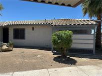 Modest single-story home with a stucco exterior, tiled roof, and desert landscaping at 227 N Lamb Blvd # A, Las Vegas, NV 89110
