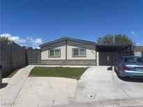 Charming single-story home with a well-manicured front yard and a covered parking area at 4184 Lady Lucille Ct, Las Vegas, NV 89115