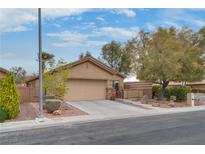 Charming single story home with a well-manicured front yard and two car garage in a quiet neighborhood at 4204 Sprints Race Ave, North Las Vegas, NV 89084