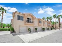 Beautiful multi-Gathering home with attached garages and palm trees against a bright blue sky at 5000 Red Rock St # 259, Las Vegas, NV 89118