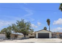 Charming single-story home featuring an attached garage and a well-maintained front yard with mature trees at 6305 Fairwood Ave, Las Vegas, NV 89107