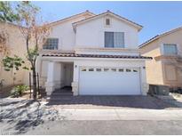 Charming two-story home with a well-maintained front yard and two car garage at 7371 Catmint St, Las Vegas, NV 89113