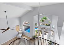 Bright entryway boasts large windows, high ceilings, a ceiling fan, and tile flooring at 9417 Grenville Ave, Las Vegas, NV 89134