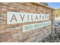 Stone community sign for Avila Park with address, set against a textured stone wall at 1832 N Decatur Blvd # 104, Las Vegas, NV 89108