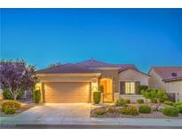 Charming single-story home with a manicured front yard and a two-car garage at 2144 Marywood Park Ct, Henderson, NV 89044