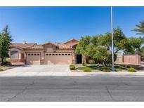 Charming single-story home features a three-car garage and well-manicured front yard with mature landscaping at 2200 Valley Heights Ave, Henderson, NV 89052