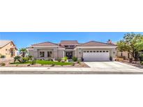 Stunning single-story home with well-manicured landscaping and a spacious three-car garage at 3028 Treesdale Dr, Las Vegas, NV 89134