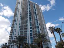 Modern high-rise building with balconies and palm trees at 322 Karen Ave # 2606, Las Vegas, NV 89109