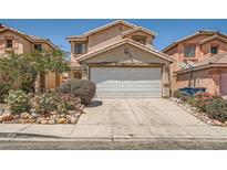 Charming two-story home with well-manicured landscaping and a two-car garage in a suburban neighborhood at 4832 Englewood Ave, Las Vegas, NV 89139