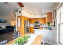 Bright kitchen features stainless steel appliances, plenty of cabinet space, and a view into the living area at 520 Arrowhead Trl # 1322, Henderson, NV 89015