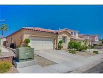 Charming single-story home featuring a terracotta tile roof and a spacious two-car garage at 5548 Spearfish Lake Ct, Las Vegas, NV 89148