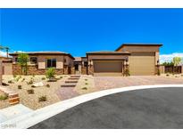 Charming single-story home with a two-car garage, landscaped front yard, and desert-friendly landscaping at 5739 Christian Creek Ct, Las Vegas, NV 89149