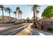 Inviting Jasmine Ranch community entrance with lush landscaping and well-maintained street view at 5855 Valley Dr # 1070, North Las Vegas, NV 89031
