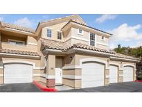 Inviting condo featuring a private garage and a classic tile roof, perfect for comfortable living at 5855 Valley Dr # 1070, North Las Vegas, NV 89031