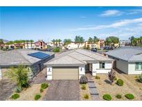 Charming single-story home featuring a neutral color palette and well-maintained desert landscaping at 6432 Linden St, North Las Vegas, NV 89086