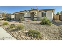 Charming single-story home featuring desert landscaping and an attached two-car garage at 6432 Linden St, North Las Vegas, NV 89086