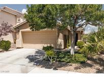 Charming single-story home with a two-car garage and mature landscaping in a residential neighborhood at 820 Bernini St, Las Vegas, NV 89144