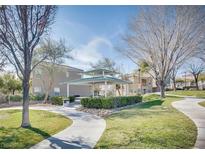 Inviting community park featuring a covered picnic area, lush landscaping, and walking paths for residents to enjoy at 9140 Entrancing Ave, Las Vegas, NV 89149