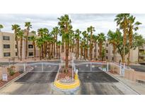 Gated entrance with lush palm trees creating a welcoming atmosphere to the condo community at 2040 Mesquite Ln # 203, Laughlin, NV 89029