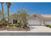Charming single-story home features a two-car garage, neutral paint and desert landscaping at 2889 Anteres St, Las Vegas, NV 89117