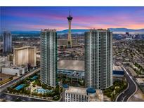Stunning aerial view of high-rise condos and the Stratosphere tower against a colorful dusk sky in Las Vegas at 322 Karen Ave # 2201, Las Vegas, NV 89109