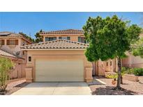 Charming two-story home featuring a tile roof, desert landscaping, and an attached two-car garage at 401 Sonoma Valley St, Las Vegas, NV 89144