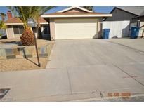 Charming single-story home with a two-car garage and desert landscaping at 4354 Thorndale Pl, Las Vegas, NV 89103