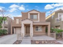Inviting two-story home with a cozy front porch and charming architectural details at 6284 Anticline Ave, Las Vegas, NV 89139
