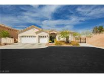 Charming single-story home featuring a three-car garage, landscaped front yard, and stucco exterior, inviting curb appeal at 6688 Martinsville Pl, Las Vegas, NV 89110