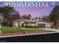 Charming single-story home with a well-manicured lawn, tile roof, and a two-car garage in a desirable neighborhood at 9029 Rivers Edge Dr, Las Vegas, NV 89117