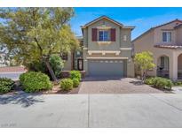 Charming two-story home with a brick driveway and a well-maintained front yard at 10845 Drake Ridge Ave, Las Vegas, NV 89166