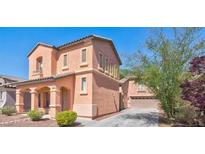 Charming two-story home features stucco siding, arched entryway, and well-maintained landscaping at 11274 Civita St, Las Vegas, NV 89141