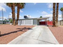 Charming single-story home featuring desert landscaping and covered parking at 1828 Golden Arrow Dr, Las Vegas, NV 89169